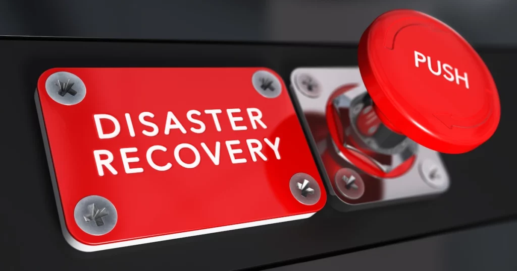 An image of a red button to push to initiate the disaster recovery plan.